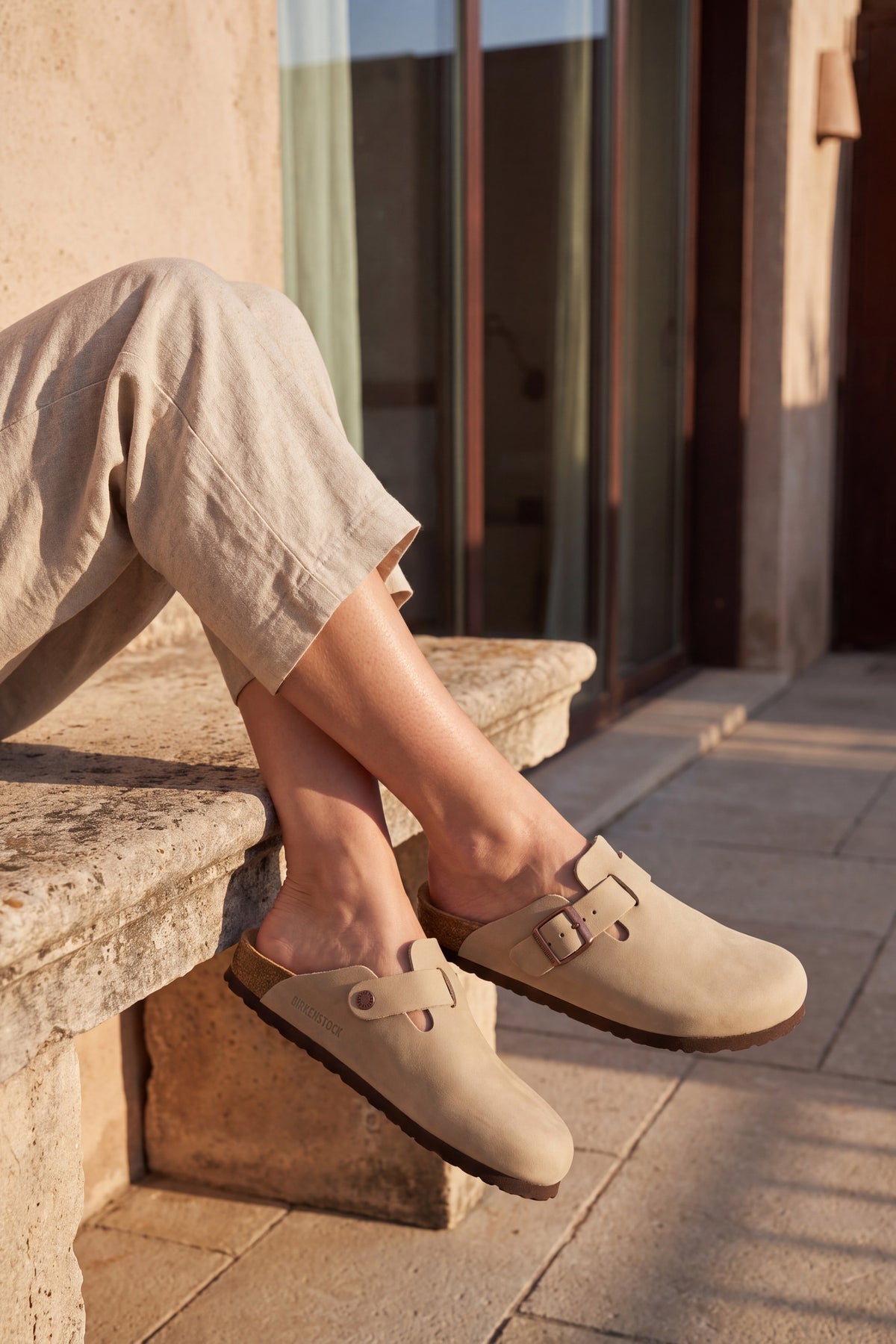 Marnie stone suede slip on clog, seated close up of straps, buckles and heel